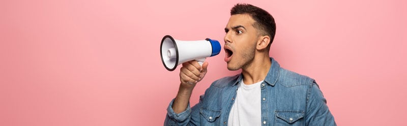 A man shouting over a bullhorn, an image many think of when they think of advertising.