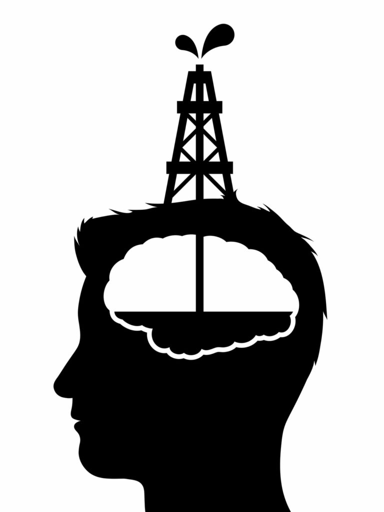 Drilling down into your ultimate purpose illustrated by a silhouette of an oil well drilling into a person's mind.  